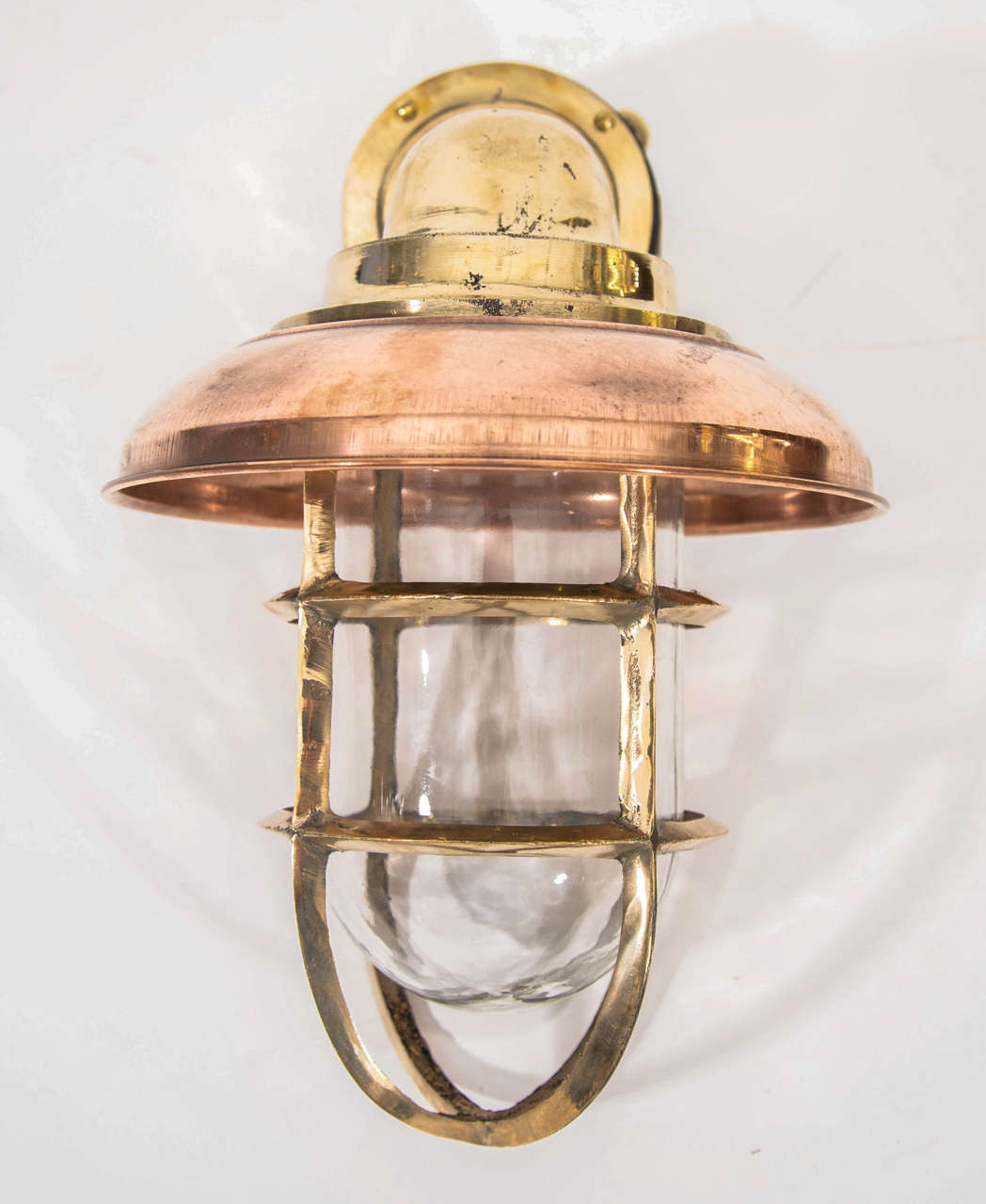 Copper and brass nautical sconces from a decommissioned Dutch naval vessel.
Re-wired and polished for indoor and outdoor use.